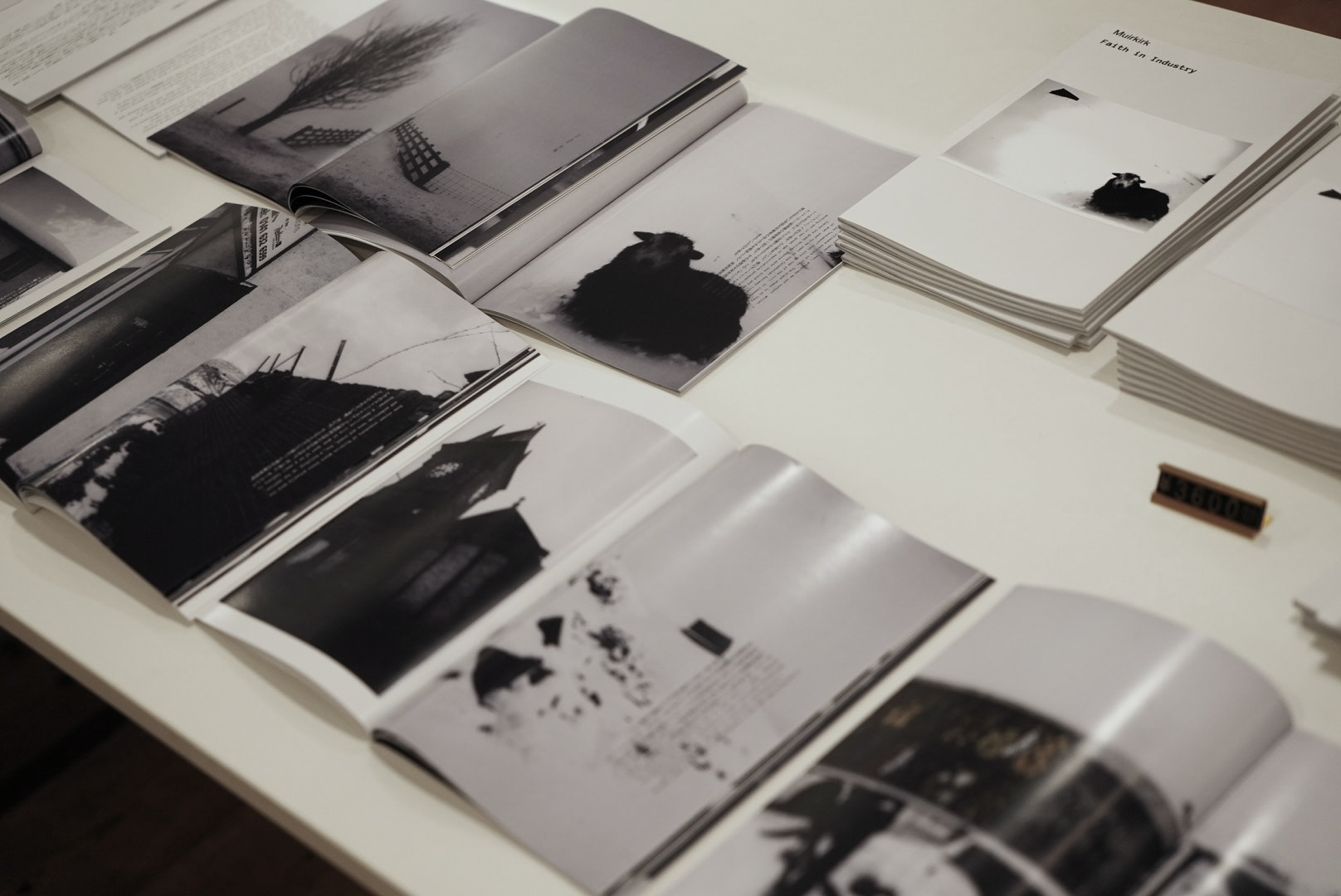 Open spreads of the Muirkirk Faith in Industry book on display